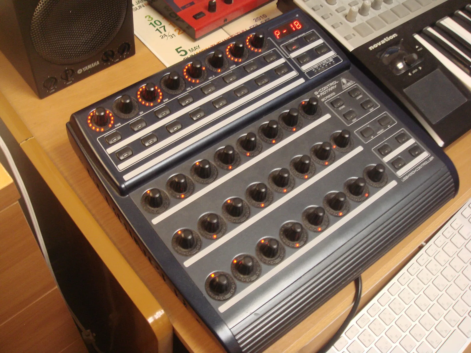 A Behringer B-Control Rotary BCR2000 controller with rows of rotary knobs lit by red LED rings